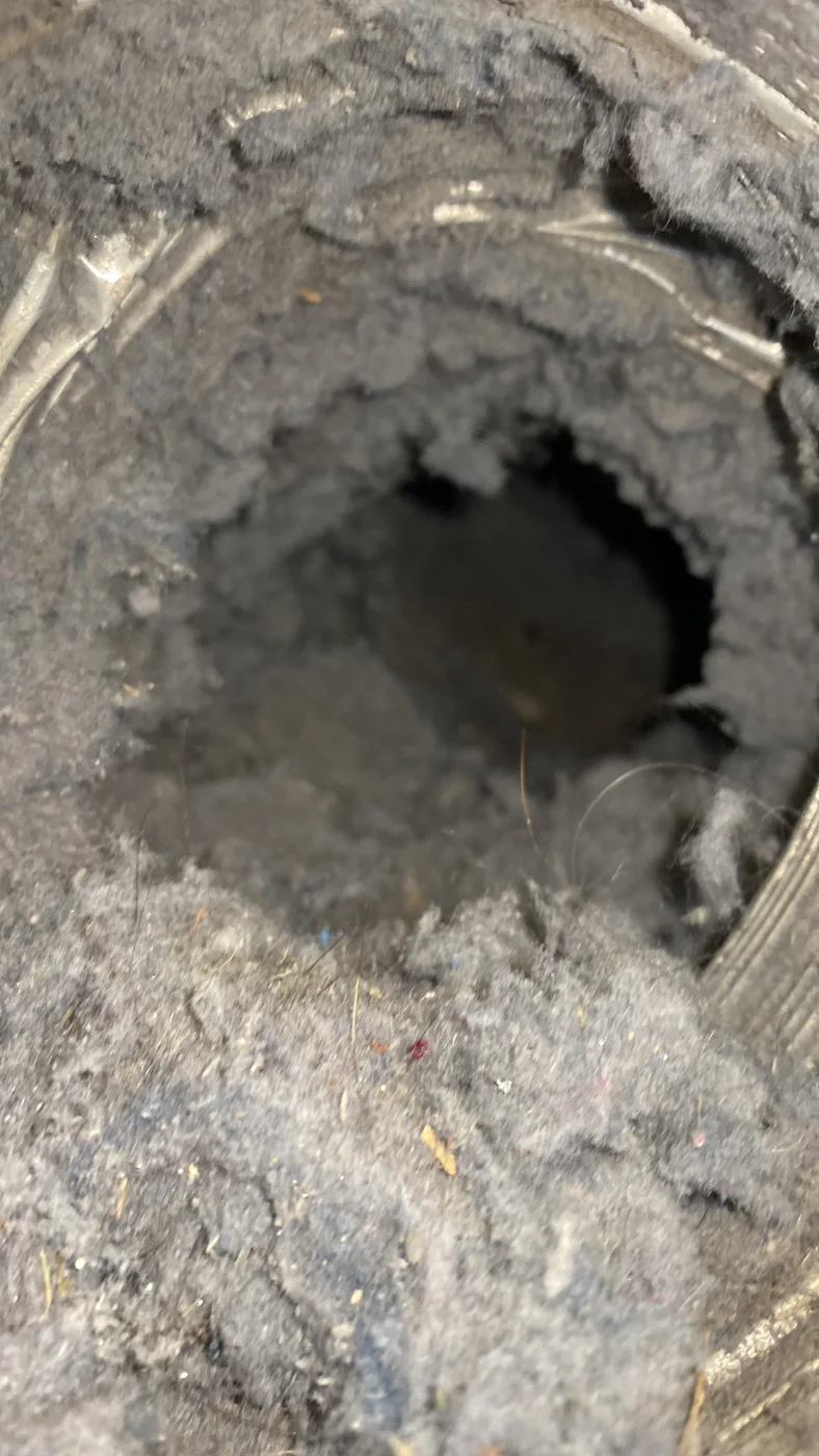 Thick lint accumulation around the inner wall of a dryer exhaust duct